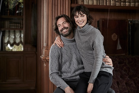 Paolo wears our vanisè cashmere turtleneck, Beatrice wears our wool blend turtleneck with bright lurex detail